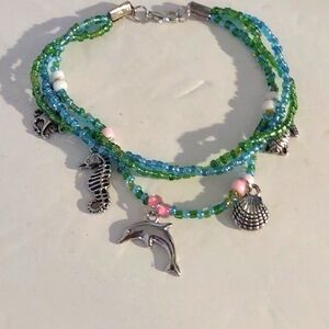 Handmade beaded sea themed bracelet blue/green charms